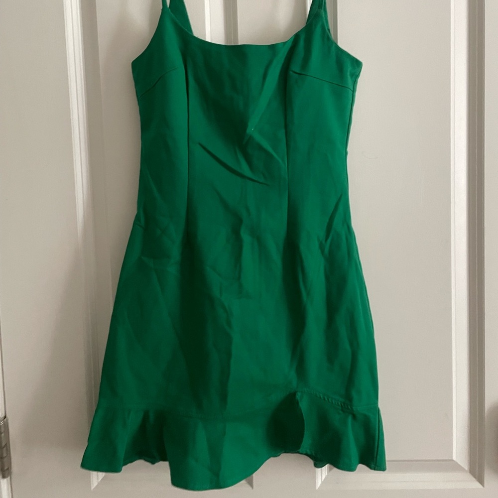 by the way. | Green dress w/ low cut back |